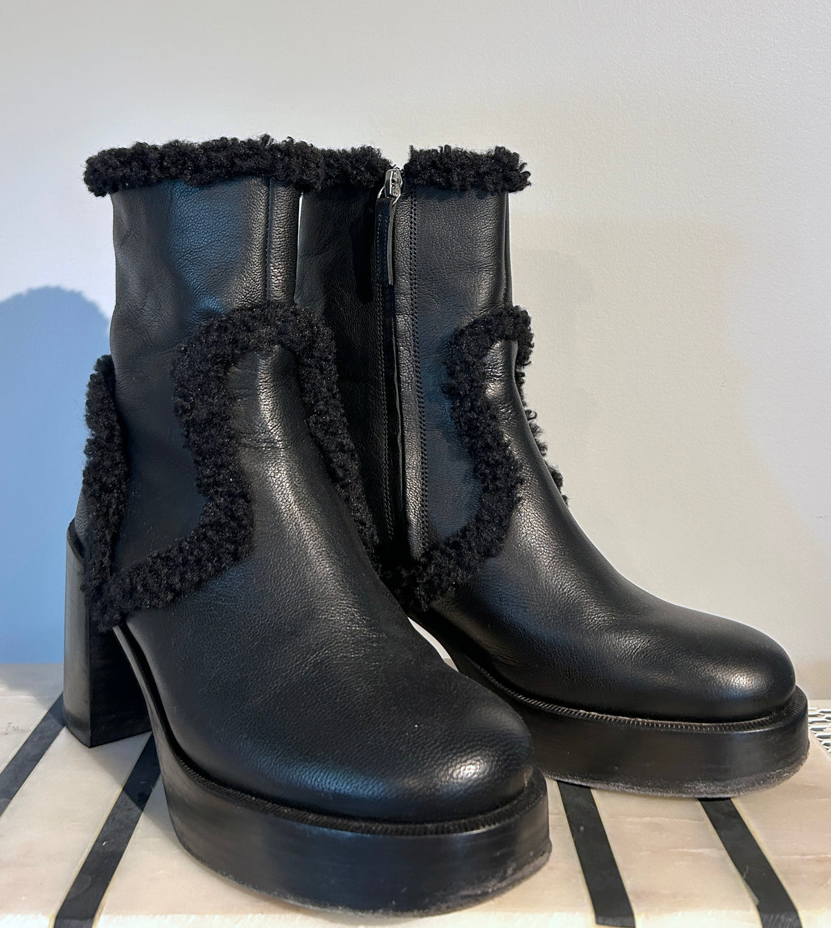 Simon Miller Low Raid black leather ankle boots with shearling trim and side zippers, size 40.
