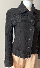 Issey Miyake blazer in size 6, tailored fit, with classic collar and button closure, shown on a hanger.