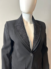 Black Ann Demeulemeester 2-way blazer in size 34/2, tailored fit, shown on a hanger with front and back views.
