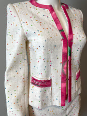 Escada skirt suit in size 4, featuring a tailored blazer and matching skirt, displayed on a hanger.