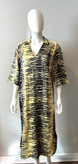Ganni yellow and black crinkle dress in size XS, showing a stylish sleeveless design with a relaxed fit and vibrant pattern.