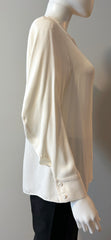 Fendi cream blouse size 40/6, elegant women's clothing with soft fabric and classic design, displayed on a hanger.