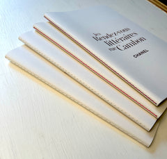 Chanel lined notebook with elegant cover, designed for home use, featuring the luxury brand's signature style and high-quality paper.