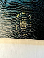 Dark green Sloane Stationery ruled journal with a textured cover and gold foil accents, ideal for home note-taking and journaling.