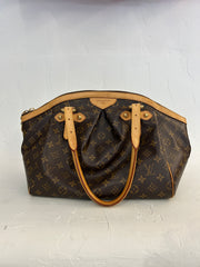 Louis Vuitton Monogram Tivoli GM bag with leather handles and gold hardware, showcasing the iconic monogram canvas.