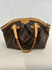 Louis Vuitton Monogram Tivoli GM bag with rounded top handles and spacious interior, featuring iconic monogram canvas.
