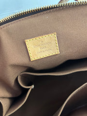 Louis Vuitton Monogram Tivoli GM bag with double leather handles and gold-tone hardware, featuring iconic LV monogram canvas.