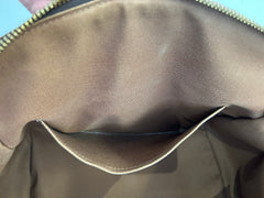 Louis Vuitton Monogram Tivoli GM bag with leather handles and gold hardware, featuring the iconic LV monogram canvas.