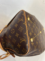 Louis Vuitton Monogram Tivoli GM bag with leather handles and gold-tone hardware, featuring the signature LV monogram canvas.