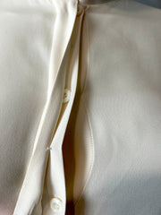 Fendi cream blouse size 40/6, stylish women's clothing with a tailored fit and elegant design, shown on a hanger.