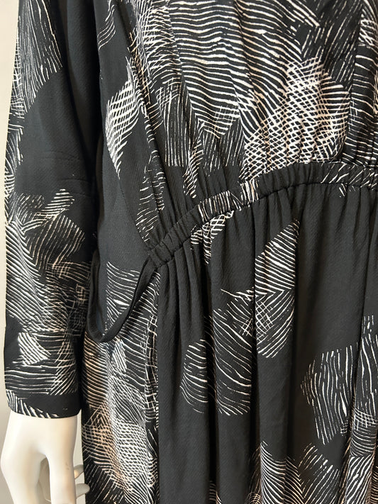 Raquel Allegra XL graphic print dress displayed on a hanger, showcasing its vibrant design and relaxed fit.