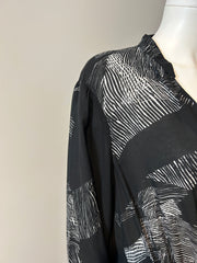 Raquel Allegra XL graphic print dress showing a flowing fabric design with bold, artistic patterns on a stylish clothing piece.