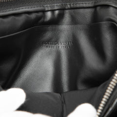 Black Bottega Veneta Leather Intrecciato Padded Square Pouch showing textured woven leather and compact design.