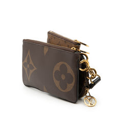 Louis Vuitton Monogram Reverse Giant Trio Pouch Set featuring three stylish SLG pouches with iconic monogram and reverse monogram design.