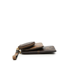 Louis Vuitton Monogram Reverse Giant Trio Pouch Set featuring three elegant SLG pouches with monogram design and gold-tone accents.