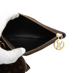 Louis Vuitton Monogram Reverse Giant Trio Pouch set featuring three stylish SLG pouches with iconic LV monogram design.