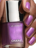 Chanel Vernis Nail Colour bottles in various shades, featuring sleek packaging and vibrant, glossy finish for beautiful nails.