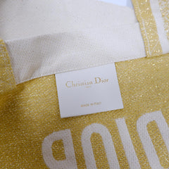 Christian Dior J'Adore tote bag in beige with floral design, showcasing the luxurious Dior bag with elegant handles and detailed craftsmanship.