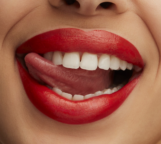 M.A.C Lustreglass Sheer-Shine Lipstick in various shades, showing glossy finish and smooth texture on lips.