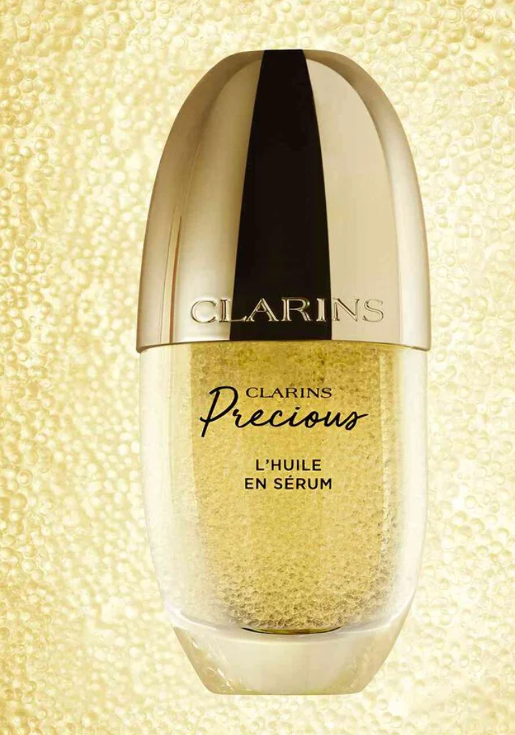 Clarins Precious L’Huile en Sérum face oil serum in 30ml bottle, highlighting its elegant packaging and luxurious skincare formula.