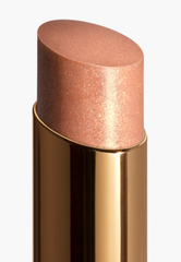 Chanel Rouge Coco Flash lip gloss in various shades, new in box, showcasing glossy, vibrant lip color and elegant packaging.