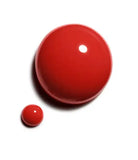 Chanel Vernis nail color bottles in various shades, glossy finish, with sleek black caps and colorful polish visible.
