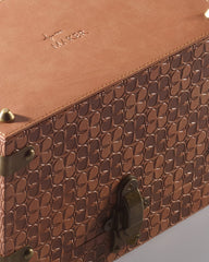 The Maker leather jewelry box with compartments, showing a sleek brown leather exterior and detailed stitching.