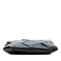 Black Bottega Veneta Small Leather Maxi Intrecciato Slip Tote bag with woven leather design and structured shape.