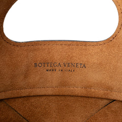 Black Bottega Veneta Small Leather Maxi Intrecciato Slip Tote bag with woven leather design and sleek structure.