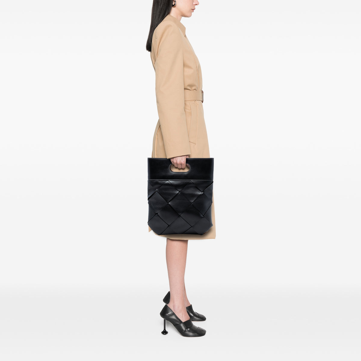 Bottega Veneta small black leather Maxi Intrecciato slip tote bag with woven design and sturdy handles.
