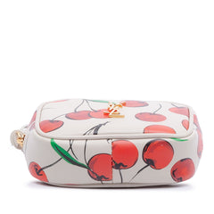 Yves Saint Laurent Lou camera bag in cherry print calfskin leather with monogram logo and gold-tone hardware.