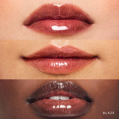 Rare Beauty Positive Light Luminizing Lip Gloss in various shades, unopened, showcasing shiny, smooth lip gloss tubes with colorful caps.