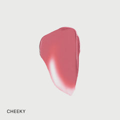 Merit Flush Balm Cream Blush in various shades, showing the creamy texture and natural finish on cheeks.