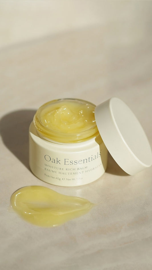 Oak Essentials Moisture Rich Balm 40g beauty product, close-up of the nourishing balm jar with label and lid.