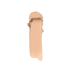 Ilia Skin Rewind Blurring Foundation and Concealer Complexion Stick in several shades, displayed with a poplar wood background.