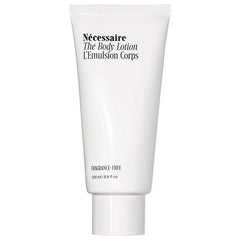 Nécessaire The Body Lotion firming moisturizer in a 200ml bottle, with a sleek, minimalist design and label visible.