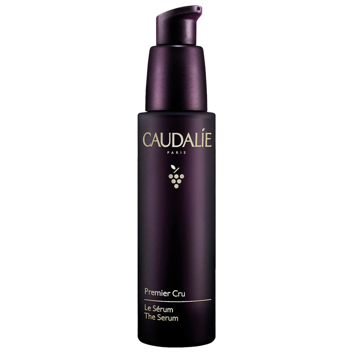 Caudalie Premier Cru Anti-Aging Serum bottle with pump, 30ml, in sleek packaging on a reflective surface.