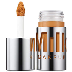 Milk Makeup Future Fluid hydrating concealer in shade 22NW NIB, with a sleek tube and applicator, displayed against a neutral background.