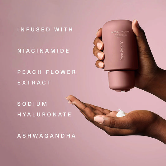 Rare Beauty Find Comfort Niacinamide Hydrating Body Lotion in 850ml bottle, smooth, moisturizing skincare product with a clean design.