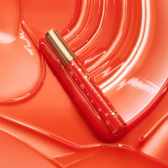 Gucci Gloss à Lèvres hydrating plumping lip gloss in multiple shades, shown in a close-up image of the glossy, smooth lips.