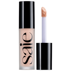 Saie Slip Tint Radiant All-Over Concealer in multiple shades, open compact showing smooth, tinted concealer for natural skin finish