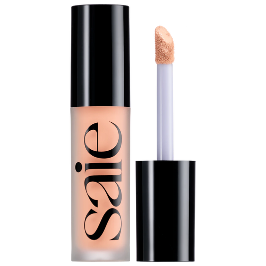 Saie Slip Tint Radiant All-Over Concealer in various shades, showing smooth, lightweight formula in a sleek container.
