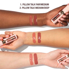 Charlotte Tilbury Big Lip Plumpgasm plumping lip gloss in a sleek tube, showcasing its glossy finish and luxurious packaging.