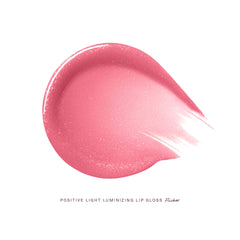 Rare Beauty by Selena Gomez Positive Light Luminizing Lip Gloss in various shades, unopened, showing glossy finish and colorful packaging.