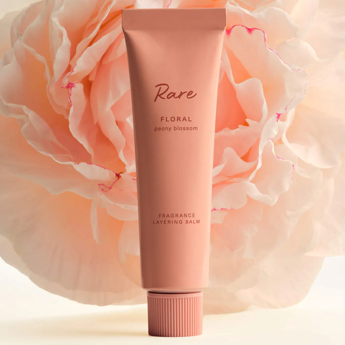 Rare Beauty Floral Peony Blossom fragrance layering balm in a 20ml container, unopened, with floral and pink packaging.