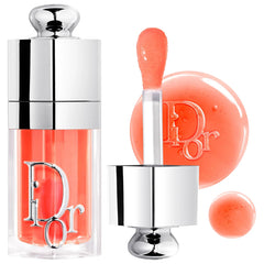 Dior Lip Glow Oil hydrating high-shine gloss in a sleek tube with a doe-foot applicator, featuring a glossy finish and Dior branding.