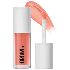 Sunlit image of Makeup by Mario Hydrating SuperShine Lip Gloss in various shades, showcasing glossy, hydrating lip color.