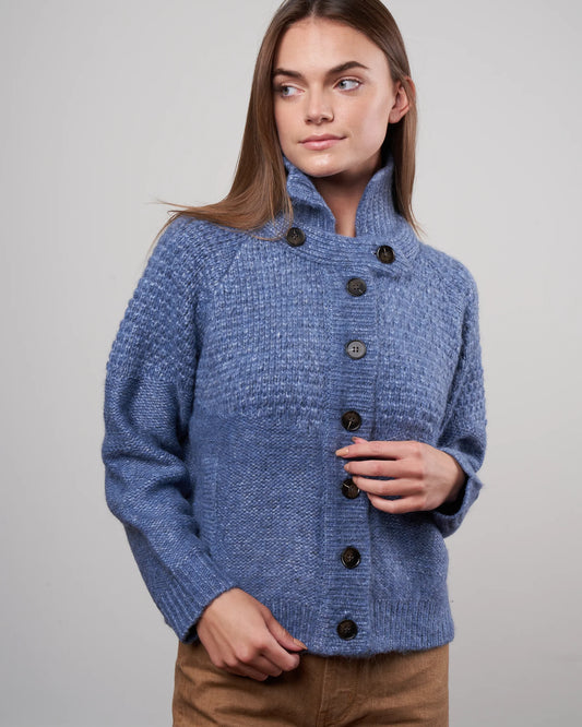 The Great shrunken hearth cardigan in saltwater blue, size S, displayed on a hanger showcasing its cozy, cropped design and soft fabric.