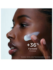 Clarins Precious La Crème Bright 50ml jar of luxurious skincare cream with a gold lid, displayed on a reflective surface.