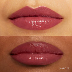 Rare Beauty Soft Pinch Tinted Lip Oil Stain in various shades, packaged in a sleek tube with a doe-foot applicator.